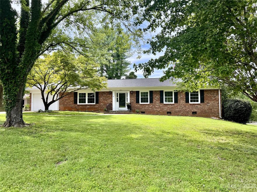 One story living in desirable Lakeland Park!  Enjoy your own private neighborhood lake beach club and beautiful lake views as you drive home to this lovingly renovated ranch home.  Wonderful location near downtown Hickory, 321, Hickory City Parks, Riverwalk, and Hickory's ASU campus.  Updates include restored original hardwood floors, all new stainless kitchen appliances, quartz kitchen and bathroom countertops, replacement windows, new light fixtures, fresh paint throughout, luxury vinyl plank in kitchen and bathrooms, freshly painted kitchen cabinets, moisture barrier in crawl space, new storage shed, and torsion garage door system.  Large covered back porch.