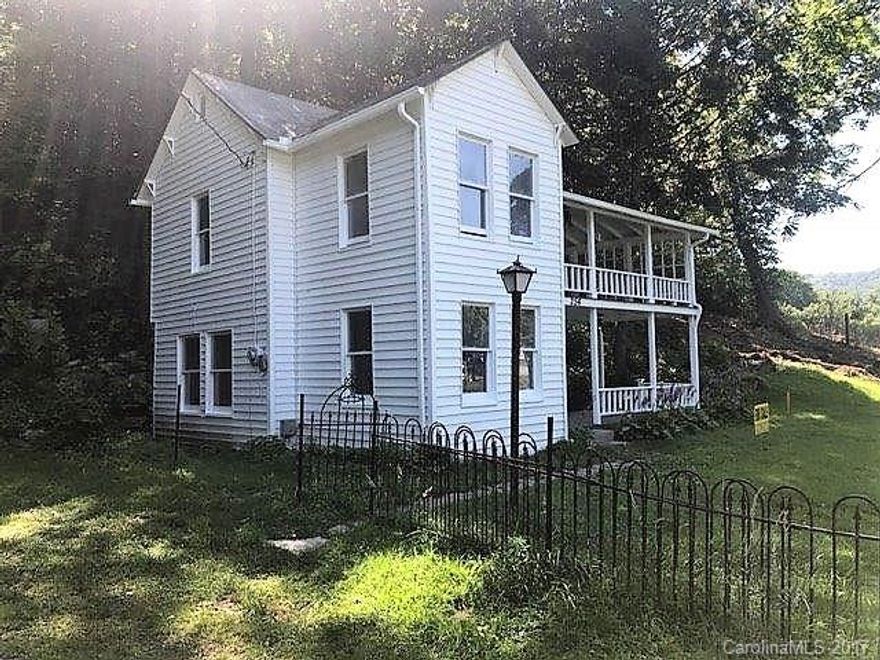 Must see this 1907 Remodeled home on 1/3 acre lot. Lot is unique with lots of stone, rocks and area for firepit and outdoor living on treed lot. Home is small but charming. Large porches upstairs and downstairs to watch the outdoor life in quiet area close to downtown Black Mountain. Adjoining 0.324 Acre lot is available with home for extra $45,000.