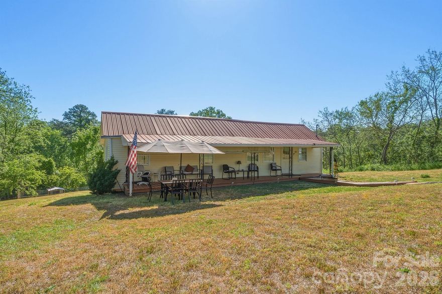 A charming and prettier in person home in Glen Alpine. A hometown community in the heart of the Blue Ridge Mtns. A spacious one level 3 Br/ 1.5 Ba ranch w/ basement and a new detached Dbl carport & outbuilding for additional storage. Pleasantly sitting on a 1.3-acre plat ready to be fenced for pets, play or gardening. Plenty of room for RV Parking conveniently located to amenities of shopping, I-40, Catawba River and Lake James activities. Public water, sewer, trash & cable. Welcoming front deck opens to charm and a "feel at home" floorplan. Covered back deck overlooks a private useable acre. Primary bedroom w/ adjoining 2nd bedroom making it perfect for a nursery, small child, elderly parent or Office. Open kitchen and dining area with ample cabinets & appliances remaining. Separate Laundry room with full size hookups. Updated full bathroom and half bath in third bedroom with ample closet space. Replacement windows and blinds. HVAC 2024. Home occupied. Please no drive-by. Shown by Appointment only.