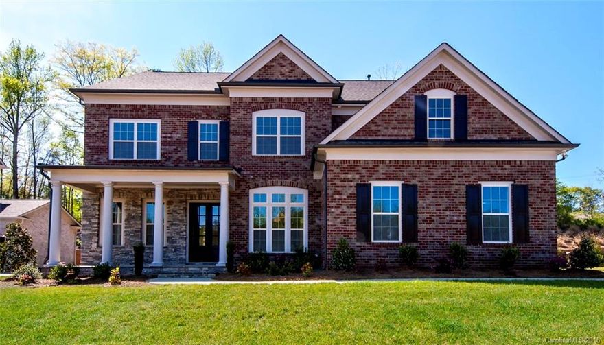 LAST MOVE-IN READY HOME IN THE RETREAT! Beautiful All Brick & Stone Combo Home w/Front Porch & Double Door Entry. 5 bedrooms, 4baths, 3 car garage and an unfinished 3rd floor walk up attic for future expansion!  Open first floor layout! 2nd Floor features secondary bedrooms, rec room and spacious master suite w/ spa like bathroom w/ a corner tub and angled shower.   Don't wait to build start the new year with a new home! Current promotion is a $5,000 design allowance!