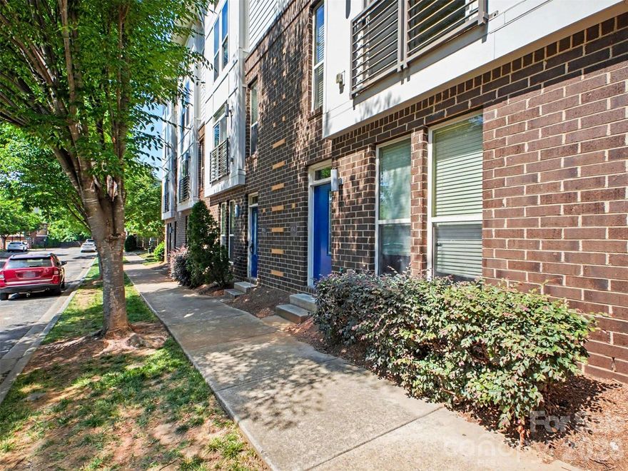 Modern three-story townhome in Charlotte’s vibrant Arts District offering the perfect blend of style, convenience, and urban living. This 3-bedroom, 2.5-bath residence features an open-concept main level with spacious living and dining areas, laminate wood floors, natural light, and a beautifully appointed kitchen with granite countertops, dark cabinetry, oversized island, and ample storage. The second-level primary suite provides a private retreat with a spacious bath and dual vanities, while two additional bedrooms and a full bath on the third floor create flexible space for guests, roommates, or a home office. Enjoy low-maintenance living just minutes from NoDa, Uptown, dining, entertainment, light rail access, and all that Charlotte has to offer. Ideal for buyers seeking location, functionality, and modern city living.