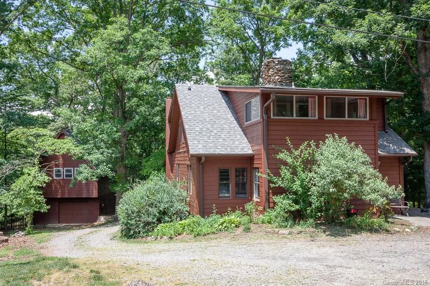 Unique log cabin full of history located in the heart of East Asheville. Two lots for one price. Cabin on first lot. Second adjacent lot has one car garage with partially finished studio space above, with power (water & sewer available.)  Includes PIN #9668263648