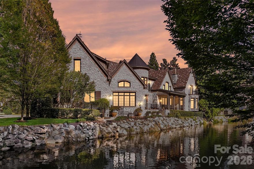AUCTION BIDDING OPEN: Bidding ends February 25th. Previously Listed $2.325M. Current High Bid $1.7M. Showings Sundays 2-4pm and By Appt. An exceptional French-inspired residence awaits within the exclusive gates of Courance, Charlotte's most distinguished Provençal village. This pristine estate captures refined European elegance with nearly one acre of private waterfront sanctuary offering remarkable tranquility. Expansive water vistas unfold from the elevated veranda and patio, where 180-degree pond views create an idyllic backdrop for intimate gatherings and grand-scale entertaining alike. Brazilian cherry hardwood floors flow throughout spacious living areas enhanced by custom moldings, dual staircases, and three stunning fireplaces. The gourmet chef's kitchen features premium SubZero and Viking appliances alongside thoughtful details including dual pullout cutting boards and warming drawer. A versatile fitness suite with kitchenette and media loft expands lifestyle possibilities, while the authentic French Ludowici clay tile roof with 65-year warranty ensures enduring beauty and protection for generations.