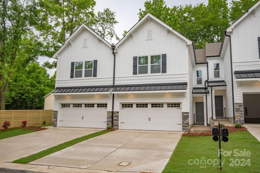 Downtown Cornelius' most exciting new location- Feriba Place Townhomes- are just a block from the heart of Cornelius with the fabulous Cain Arts Center within view of your front porch.  This new-construction townhome  is complete and ready for immediate occupancy with fully transferable top-to-bottom builder warranty. Over-sized driveway will easily accommodate two cars side-by-side or park inside your fully attached two-car garage. The home is bright with plenty of windows and open floor plan. Kitchen includes upgraded stainless appliances , full pantry, and quartz countertops. Primary bedroom on second level is spacious with large windows. Primary bath has a dual sink vanity and oversized shower with tile surround. Two additional bedrooms are spacious and bright. Second level laundry room, storage and shared full bath complete the living space. Private fenced back yard with patio.  Ask about our incentives for a closing before end of 2024!
