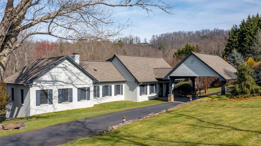 Spectacular Fairview estate with incredible versatility on over 4.5 beautiful rolling acres. Private and spacious, yet less than 20 minutes to downtown Asheville, this property offers numerous options for use — full family retreat, primary residence with rental cottage, or entire property STR. The four-bedroom main house features more than 3,500 SF, beautiful hardwood floors, main-level primary bedroom suite, multiple options for living and gathering space, and a beautiful in-ground pool. The adjacent private guest cottage is spectacularly finished with a sleek, modern cabin vibe with two bedrooms, ample living space, and fully equipped kitchen. The property intrigue only grows as you head outside, as private hot tub space, two stone fire-pit areas, flat usable yard space, and ideal areas to expand await.  This one-of-a-kind property truly is a must-see!