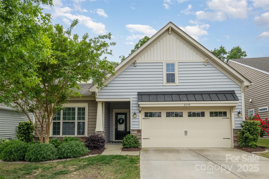 Step into charm, comfort and convenience with this beautifully updated 4-bed, 3-bath home minutes from top-rated dining, shops and the essentials of modern living. This home boasts an impressive open floor plan—perfect for entertaining or simply enjoying everyday life with ease and flow. Open kitchen shines with stainless appliances, ample cabinetry and a generous island. The spacious main-level primary suite features a cozy sitting area, large walk-in closet and a spa-inspired bath with a standalone shower. Step out from the primary onto a serene screened porch to start your day with coffee or unwind in the evening surrounded by nature. Freshly installed LVP flooring on the main level, brand-new carpet upstairs, and a neutral paint palette throughout create a move-in-ready space that feels bright, modern, and welcoming. Outside, enjoy the peaceful wooded backdrop from your private patio with a dedicated grilling area. This home is the perfect blend of style, space, and serenity.