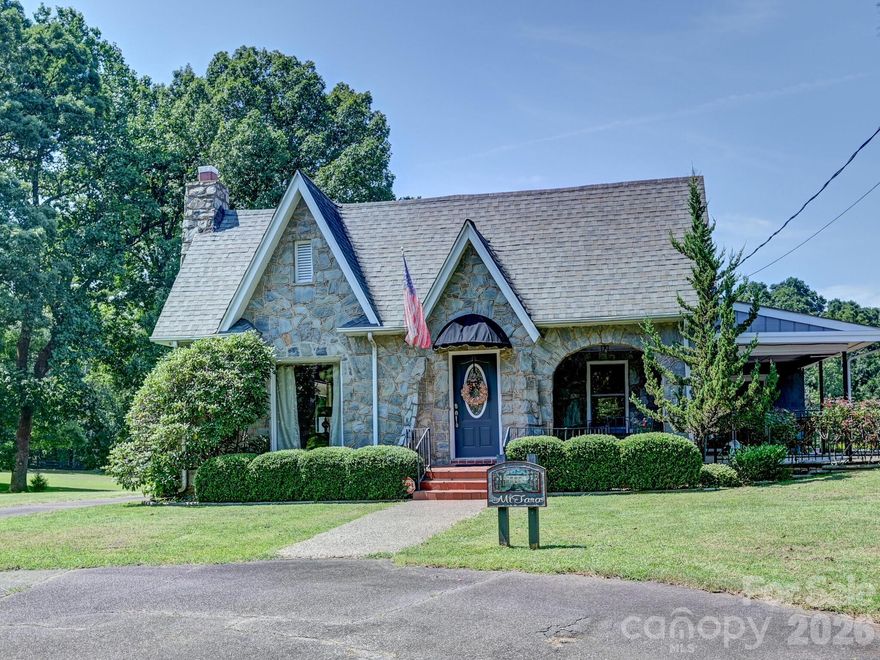 New Price! Charming cottage-style home on 5.34 fully fenced acres offering privacy, versatility, and income potential. This 4BR/3BA home features 2,132 sq ft with a functional layout ideal for full-time living, vacation use, or investment. The main level includes wood-look tile flooring, a spacious living area with cozy fireplace, granite kitchen, dedicated laundry, and a bedroom with full bath access—perfect for guests or flexible use. Upstairs offers hardwood floors, a private primary suite with balcony and full bath, plus three additional rooms suitable for bedrooms, office space, or hobbies.

The property includes multiple living areas, allowing for separation of space and comfortable hosting. Outdoor features include several seating areas to enjoy peaceful country views, along with a barn, detached garage, and small cellar for storage or utility use. A new roof adds value and peace of mind.

Being sold fully furnished, including décor, linens, and tractor—making this a true turnkey opportunity. Suitable for short-term rental, long-term rental, Airbnb, bed & breakfast, or mini farm use (buyer to verify). No HOA.

Conveniently located just minutes from Valdese, Morganton, and Lake James, offering easy access to local amenities, dining, and outdoor recreation.