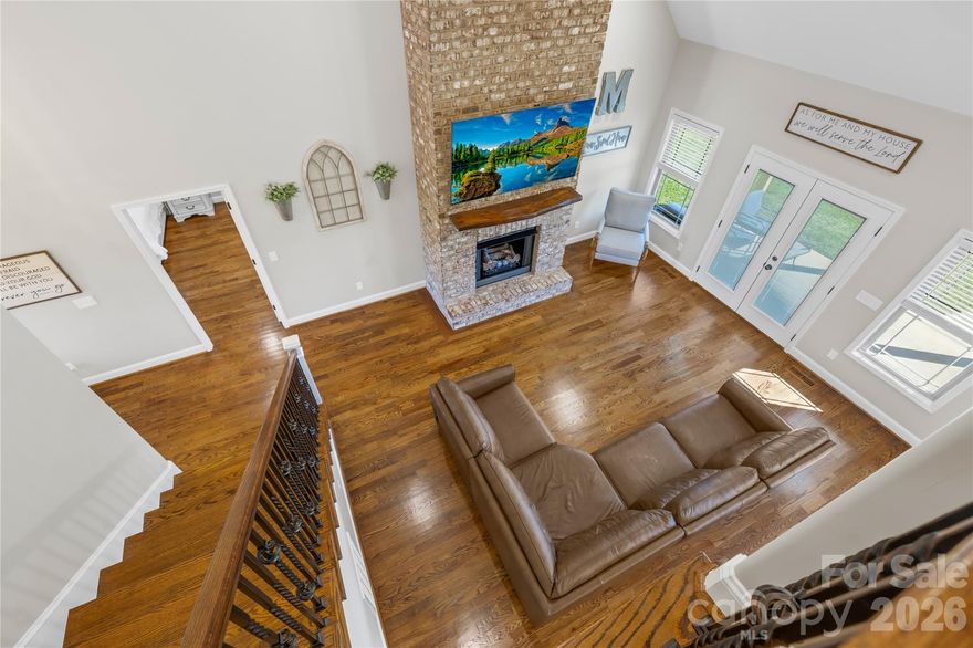 Don't just drive by and wonder... NOW is the time to come check out this next to new, custom-built full brick home offers 5 bedrooms, 3 full baths and timeless elegance throughout! Step inside to find soaring ceilings, a grand foyer, and a striking floor-to-ceiling brick fireplace in the great room. The open-concept design flows seamlessly into the gourmet kitchen featuring custom cabinetry, stainless steel appliances, and a large center island perfect for gathering and entertaining. The main level showcases 9’ ceilings, gleaming hardwood floors throughout, and a luxurious primary suite with a spa-like ensuite highlighted by a gorgeous tile shower and soaking tub. A guest bedroom and full bath are located on the main level along with a formal dining room and laundry room. Upstairs, you’ll find 8’ ceilings, 3 additional bedrooms, and a full bath ideal for guests, office space, or a playroom. Thoughtful details include tinted privacy windows for energy efficiency and curb appeal that shines with a classic rocking chair front porch flanked by stately brick columns. Enjoy outdoor living on the spacious covered rear porch, complete with a built-in gas line for grilling. With nearly an acre of land, there’s ample room to design your dream backyard with plenty of space for a custom in-ground pool! Why wait to build when this home combines luxury, comfort, and endless potential all in one remarkable package! Only minutes from Maiden, Newton, Hickory, Lincolnton, Denver & an easy drive to Charlotte via Hwy 16, this location screams country living without giving up the convenience of nearby shopping, restaurants and hospitals. *PLEASE NOTE...The outdoor photos do reflect VIRTUALLY STAGED OPTIONS for landscaping and pool! Be sure to check out the video tour!
