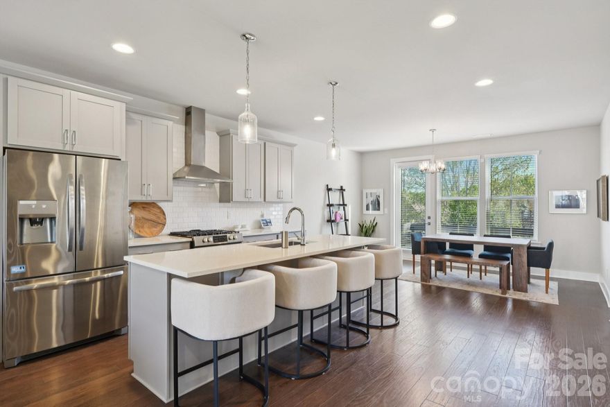 Seller is offering $10k concession for buyer to buy down the rate! Stunning South Charlotte townhome in the heart of Ballantyne with a rooftop terrace, bonus room, and two-car garage!

This beautifully designed home features an open-concept main living area filled with natural light and a seamless flow on each level going up to the private balcony, perfect for everyday living and entertaining. The kitchen is stunning, offering a large eat-in island, walk-in pantry, shaker-style light gray cabinetry, tile backsplash, stainless steel appliances, and polished quartz countertops.

Elegant 5-inch hardwood floors run throughout the main living spaces, complemented by tile flooring in the bathrooms and thoughtfully selected finishes throughout the home.

Upstairs, each bedroom offers its own full bathroom and walk-in closet, including a spacious primary suite with dual walk-in closets. A conveniently located laundry area adds to the home’s functional layout.

The top level features a versatile bonus room that opens to an incredible rooftop terrace, ideal for entertaining, relaxing, or enjoying treetop views and beautiful Carolina skies.

Additional highlights include a two-car garage with EV charger ready, smart home features, and included lawn maintenance for easy living.

Perfectly situated just minutes from shopping, dining, and entertainment at Ballantyne Bowl and Stonecrest, with quick access to I-485.