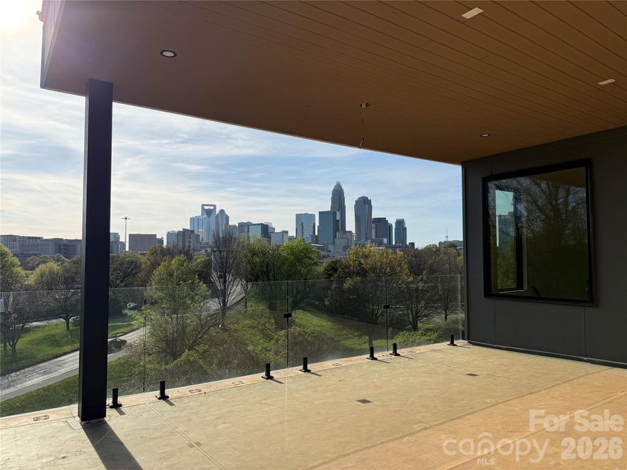 Unparalleled, unobstructed skyline views of Uptown Charlotte from multiple balconies and rooms on multiple floors. Large home with soaring ceilings and wide open floorplan. Huge kitchen with gas range, and oversized center island and separate dining island. Large pantry with sink and mini fridge. Upper floor is the primary bedroom, private balcony, wet bar, and enormous closet at almost 20x20. 5 bedrooms, each with an ensuite bath. Laundry hook-ups in the primary closet as well as laundry room on the 2nd floor. 2nd floor has three bedrooms, 1 full bath and a large 406 SF family room. Bank-owned property; exempt from disclosures. Elevator shaft in place (elevator not installed), an inground pool in place but equipment / pumps, etc, not installed. Some punch-out items incomplete, but home has been occupied. Seller to make no repairs, "as is" offers only.