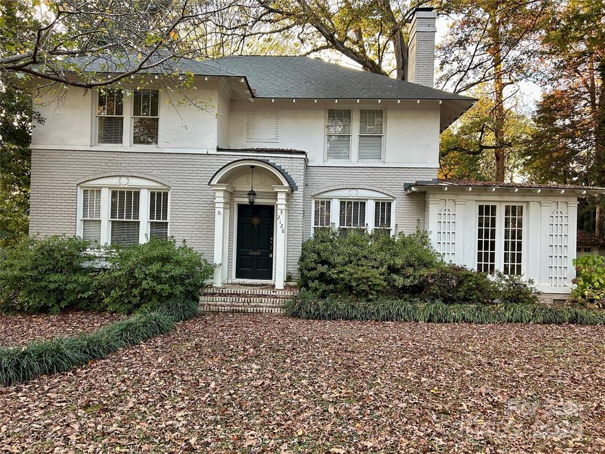 Timeless Myers Park home. Convenient to South Park Mall, restaurants, shops, and uptown Charlotte. Home has
4 bedrooms, and 3 and 1/2 bathrooms. It's situated on a 1/2 acre lot surrounded by mature hardwoods.
Plenty of parking and a detached 2-car garage. Inside you'll find hardwood floors throughout the home, large formal rooms, 2 fireplaces, and an updated kitchen with white cabinets and a gas cook top stove. Two separate sunrooms, one overlooking the shaded backyard and the other on the side of home. There's a bedroom and office on the 1st floor that share a full bath with a claw foot tub. Upstairs you'll find a large primary suite with a sitting room and fireplace as well as a  completely renovated bath. There are 2 additional bedrooms and another full bath with a new shower as well. The unfinished basement has a workshop, 1/2 bath, and laundry area.
