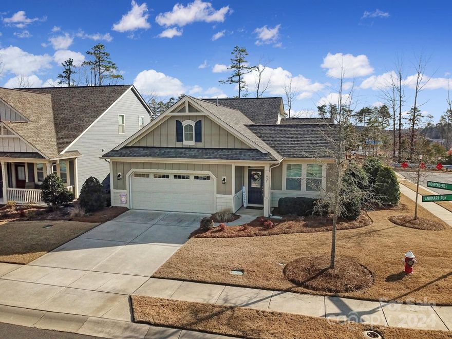 Don't miss this opportunity to live in a top ranked city in the Carolinas, Tega Cay! This stunning home has all the bells & whistles. The front office has french glass doors, wood floors and tons of natural light. The chef's kitchen is well equipped with a gas cooktop, wall oven, built-in microwave, white cabinetry, granite countertops, tile backsplash & a large island/bar. The cozy great room features a gas fireplace & is open to the kitchen. The luxurious owners suite has a huge WIC, a spa tile shower, a gorgeous vanity with 2 sinks. Guest bedroom with attached bath plus a drop zone & laundry on the main level. Huge bonus up, as well as a 3rd bedroom suite. Enjoy a cup of coffee each morning on the private, fenced, courtyard patio. Oversized 2 Car Garage. No lawn maintenance. Enjoy the community clubhouse, outdoor pool and events. Tega Cay offers resort-like amenities including beach club, marina, golf, tennis, parks, playground, restaurant & more. Mins to I-77.