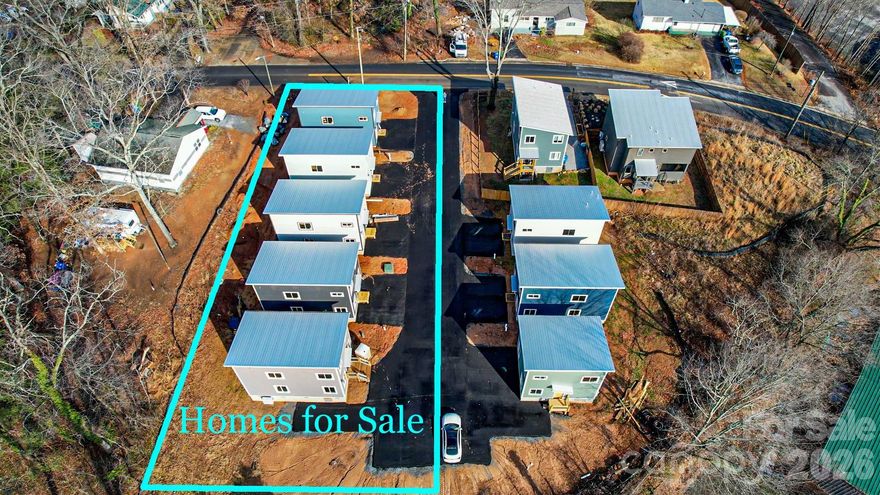 West Asheville Brand New Construction close to Haywood Road, River Arts District and Downtown. Adorable 3BR / 2.5BA with Mountain Views. Bamboo floors and Tile throughout main levels, Tall Ceilings in bedrooms, and Open Wood Beams in Living Room. Great blend of modern fixtures with warm feelings throughout- Wood floors, Tile bathrooms, Tall ceilings in bedrooms. There are almost no new homes for sale in this price point, let alone in desirable West Asheville. Come take a look! Part of a new pocket neighborhood with shared open space for all owners. Built by Compact Cottages. One Year New Home Construction Warranty and Longer warranties on many home components. House construction in final stages. 5 total houses available. Will be paved pocket neighborhood once complete.  For a smaller investor, 2 homes can be purchased for $675,000.