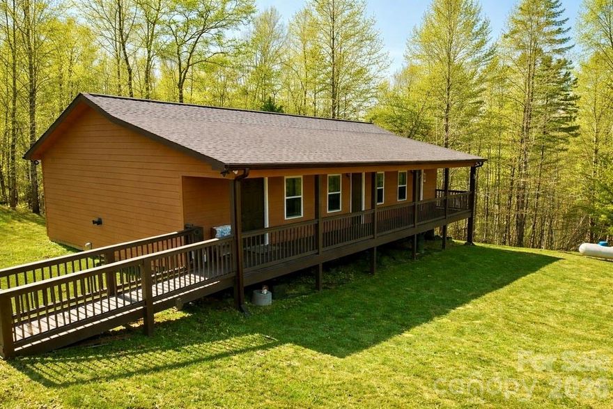 Discover your private rural retreat in the gated Hearthstone Ridge community of beautiful Rutherford County, North Carolina. This meticulously crafted 2021 custom home offers 1,350 sqft of modern, low-maintenance living on a 3.18-acre lot at the end of a quiet road—ideal for privacy and peaceful country living.

Designed with efficiency and convenience in mind, this single-level gem features **no stairs** for easy accessibility, two spacious bedrooms, and two full baths. Walk in to an open concept livingroom and kitchen area equipped with laminate countertops and a large pantry. The primary suite offers a beautiful walk-in shower, added just a few months ago. No detail was overlooked: durable Hardie board siding, a generous covered deck perfect for relaxing or entertaining, and a convenient circle driveway for effortless entry and exit.

Peace of mind comes standard with a whole-house Generac generator to ensure uninterrupted comfort during outages. Additional perks include an outdoor storage building with a concrete floor and insulated for your comfort.

This one-of-a-kind property blends modern amenities with tranquil acreage—schedule your showing today and make it yours!