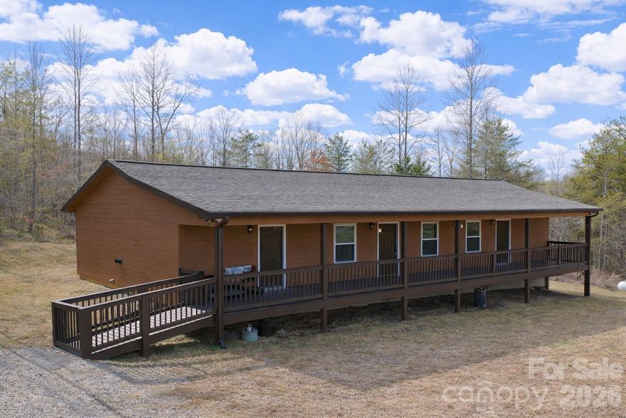 Discover your private rural retreat in the gated Hearthstone Ridge community of beautiful Rutherford County, North Carolina. This meticulously crafted 2021 custom home offers 1,350 sqft of modern, low-maintenance living on a 3.18-acre lot at the end of a quiet road—ideal for privacy and peaceful country living.

Designed with efficiency and convenience in mind, this single-level gem features **no stairs** for easy accessibility, two spacious bedrooms, and two full baths. Walk in to an open concept livingroom and kitchen area equipped with laminate countertops and a large pantry. The primary suite offers a beautiful walk-in shower, added just a few months ago. No detail was overlooked: durable Hardie board siding, a generous covered deck perfect for relaxing or entertaining, and a convenient circle driveway for effortless entry and exit.

Peace of mind comes standard with a whole-house Generac generator to ensure uninterrupted comfort during outages. Additional perks include an outdoor storage building with a concrete floor and insulated for your comfort.

This one-of-a-kind property blends modern amenities with tranquil acreage—schedule your showing today and make it yours!