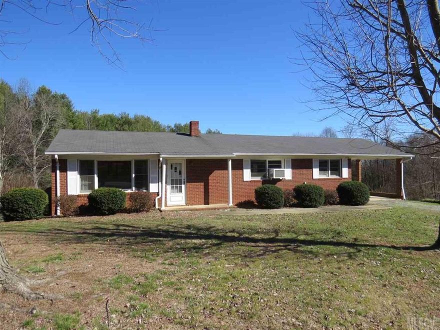 Brick home and 4+ acres in North Iredell! Full unfinished basement. Home features 3 bedrooms 1 1/2 baths and plumbed for bath in basement. Original hardwoods in living room and bedrooms. Newer septic system and roof has been replaced. Beautiful acreage with room for garden, horses or other animals with a barn! Property has road frontage on Wilkesboro Hwy. and McCarter Rd.! Most of the property is in Iredell Co. but .965 is in Wilkes Co. Home is ready for your updates and priced to sell!Come on!