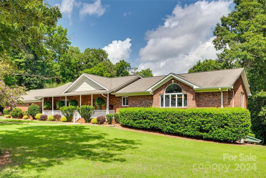 Five acres of wooded serenity,this elegantly appointed estate offers a unique blend of luxury and comfort.Imagine stepping from your rocking chair front porch into a realm where Brazilian cherry floors lead to not one,but two majestic fireplaces.The kitchen is equipped with double ovens,two dishwashers, and a five-burner gas cooktop.The estate's layout includes three bedrooms on the main level for convenience,complemented by a primary bedroom with dual closets,one exceptionally spacious.Heated bathroom floors.Tastefully designed downstairs area features a bar and wine room.Entertainment extends outdoors where a saltwater pool,hot tub, and stone firepit await,all set to the soundtrack of outdoor speakers.For enthusiasts of work and play,a 4,000-square-foot detached shop with office space and car lifts promises endless possibilities.Whether hosting parties or enjoying quiet retreats,this home seamlessly blends sophistication with charm,making every corner a celebration of refined living.