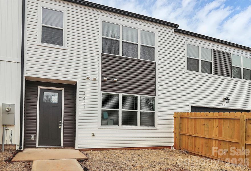 Active Construction Site, Please be careful! Beautiful New Construction Townhome close to I-85 in Charlotte! This is the middle unit and it has a full privacy fence in the front and the back! Walk into the home onto NEW LVP flooring throughout the entire home! OPEN floorplan in the main living areas on the main floor. Kitchen is AWESOME w/white shaker cabinets, granite countertops, and NEW SS Appliances! BIG island with bar seating!  UP: All bedrooms are upstairs as is the laundry. Primary suite hosts high vaulted ceilings, ceiling fan, and full bath w/dual granite vanity and walk-in shower! Both guest bedrooms are great sizes and share the additional full bathroom w/single granite vanity and tub/shower combo. This home also has a 2 car garage! NO HOA!  Come see it today!