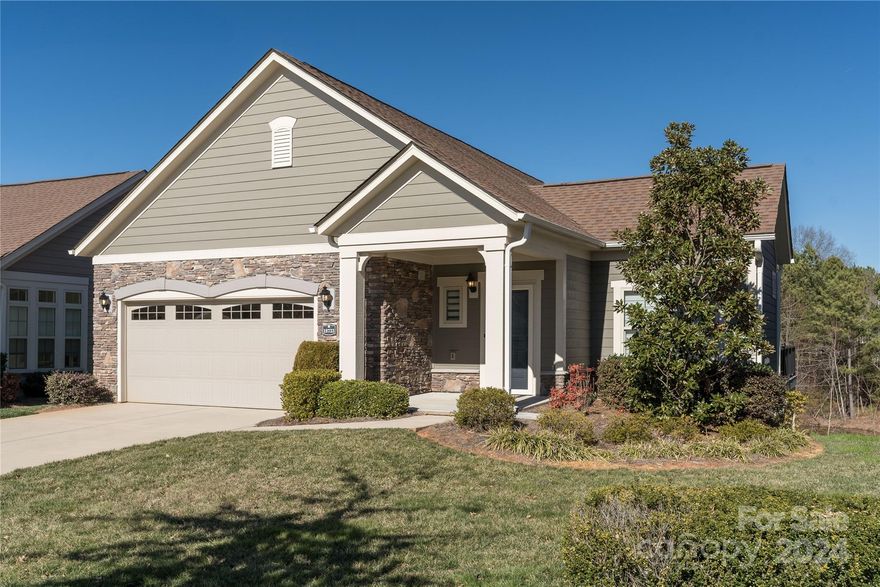 Finally, there's an immaculate ranch/basement with Primary Bedroom on main, along with second bedroom, dining area, large laundry room, pantry and a great room. Lower level would be great for guests as it boasts a huge multi-purpose rec room, office area, bedroom and full bath. This home faces the gazebo and pocket park in the front and a pond and wooded area in the rear. Many upgrades to this fabulous home include LVP flooring, tankless water heater, quartz countertops and tiled backsplash with fabulous LG smart refrigerator installed in October 22. Primary suite includes large tiled shower with natural light from sun tunnel and built in closet organizers. Newer light fixtures, convection oven, remote blind in the front, skylights in the kitchen, composite decking and newer faucets. Close to grocery store, restaurants, Lake Norman and all the conveniences Cornelius has to offer. Come see this hidden gem.