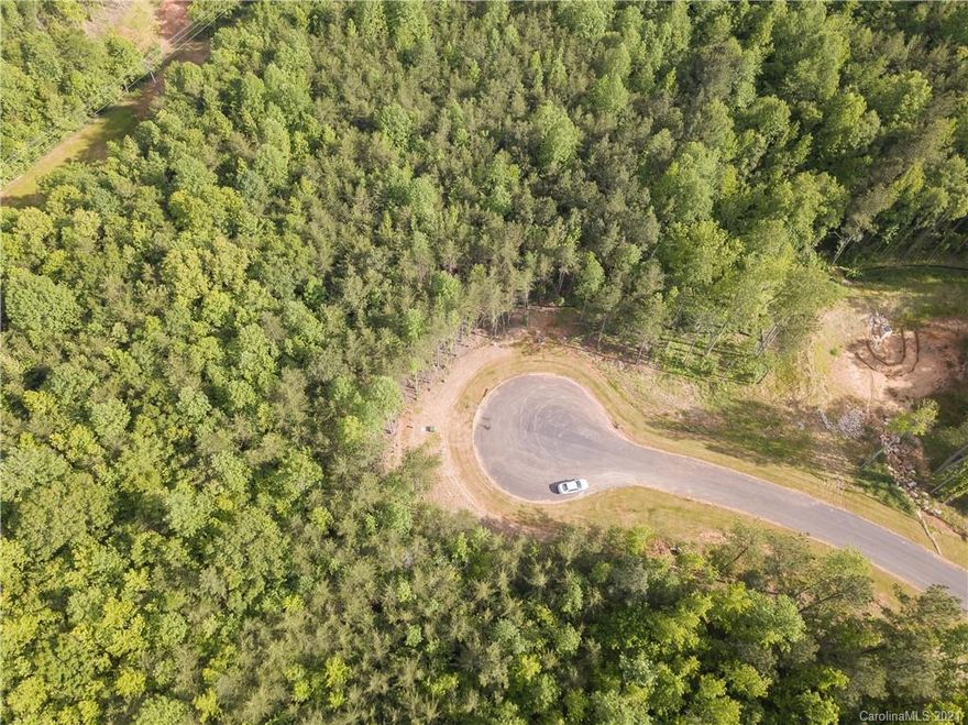 Don't miss out on this PREMIUM lot in Sanders Landing in Clover! Lots in this neighborhood are almost gone! Just over 2 acres, this wooded lot is in a cul-de-sac and ready for you to build your dream home! The septic permit has already been obtained. Bring your buyer or use one of ours.  Located in the desired Clover School District. Convenient to York, Clover, and Lake Wylie.