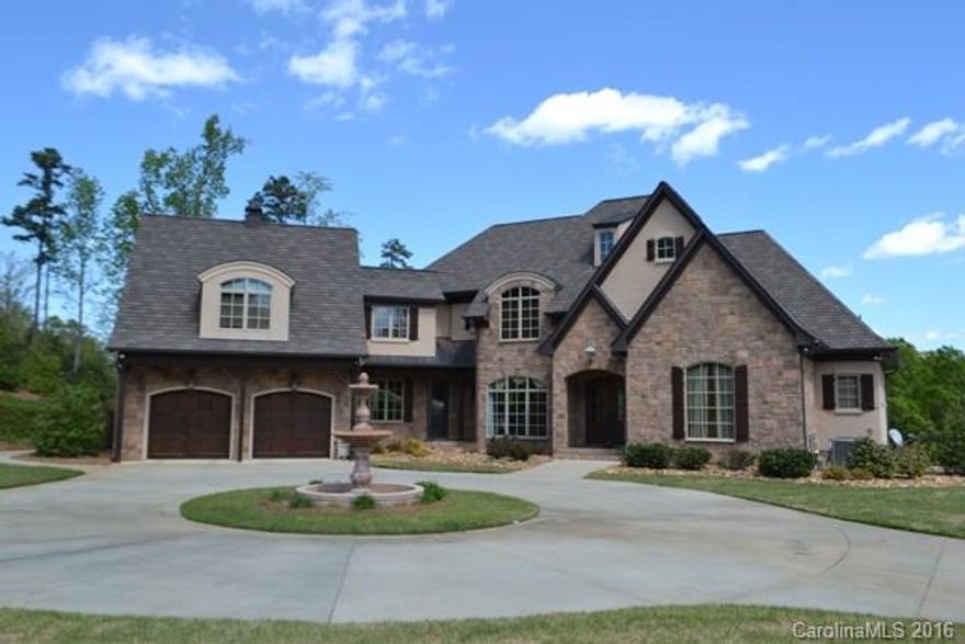 This custom built home offers lakefront living at its best! Grand entrance introduces the lake at first entrance. Great entertaining home with open floor plan. Granite chef's kitchen, floor to ceiling stone fireplace in GR and large DR. Master suite and spa like bath with heated floors on main. Inground salt water pool, hot tub, large dock with sun deck, screen porch, balcony. Property is completed fenced and gated. Detached garage offers great additional storage. Tons of architectural details.