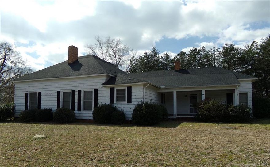 Don't miss this spacious older house located on a large corner lot, in downtown Pageland, SC! It features beautiful hardwood floors that are complimented by original period mantles and woodwork. With your own renovation/update ideas, "this old house" can become the home you have been looking for! It features a large LR w/FP, cozy den w/FP and spacious bedrooms.  It is located within walking distance of downtown amenities and also features a front covered porch, rear screened porch and storage.
