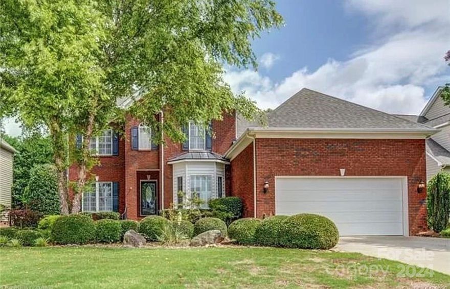 Beautiful, inviting home located in popular swim/tennis neighborhood. Perfect home for entertaining. Upgraded kitchen open to breakfast room and 2 story great room, offers tile backsplash, 42” cabinets, solid surface counters and stainless appliances. Detailed Formals. Spacious Primary suite on the main features trey ceiling, large bathroom with separate garden tub and shower, dual vanity and walk in closet. Three bedrooms and two full baths up, as well as an additional bedroom/office and bonus. Inviting, private back yard features an awesome composite covered deck with mini fridge, fans and area for tv, patio and fire pit. Conveniently located to top area schools, shopping and Lake Wylie.