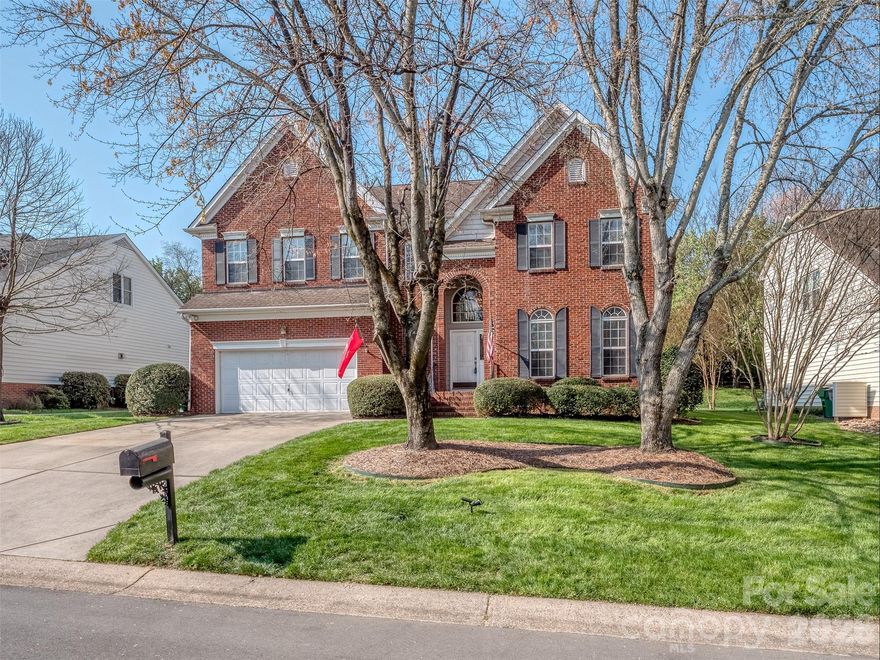 You definitely need to come see 6416 Red Maple Drive in the quiet & convenient Ballantyne Community of Orchid Hill.  Nestled just off of I485 with easy access to Stonecrest, Waverly, The Bowl at Ballantyne, & Everything Else in South Charlotte, this home is loaded with features & will provide you with just the lifestyle that you are dreaming of! For starters, the curb appeal of this home is delightful with mature trees and lush landscaping. The dramatic 2 story foyer is welcoming & flows nicely into the formal dining room & formal living room.  The kitchen features white cabinets with crown molding, granite countertops with island, tile backsplash, stainless appliances and tons of natural light.  The breakfast room is between the kitchen & oversized great room and has a lovely granite bar that is perfect for entertaining. The great room has a gas log fireplace with marble surround & custom mantle.  the 2nd floor has a large loft/bonus room that would be a perfect game room or theatre area. The primary suite is huge and has a large tray ceiling & wood floors. The primary bath also has wood floors, walk-in shower, garden tub, water closet, extended dual vanity with makeup area, & walk-in closet.  The guest rooms are quite spacious & share an oversized full guest bath.  The back yard has a spacious deck & is fairly private with mature trees & plenty of space to enjoy outdoors in the Carolinas! Everything about this home & this area will speak to you.  Welcome Home!