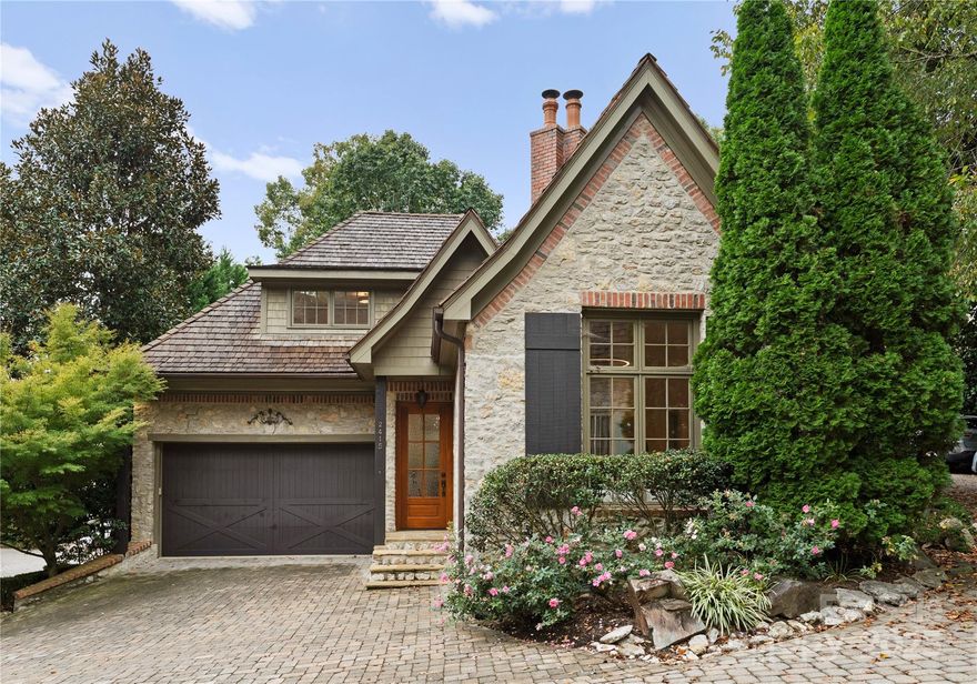 Step into the enchanting village of Courance, inspired by the beauty of the French countryside and nestled within the prestigious estates of Pellyn Wood. This beautifully remodeled home has been thoughtfully updated, featuring new wood floors throughout, an upgraded kitchen, and fully renovated bathrooms, all freshly painted.

This secluded, wooded retreat offers stunning stone architecture, cobblestone streets, and gas lanterns, creating a picturesque atmosphere reminiscent of the French countryside, all while being just minutes from Southpark and Strawberry Hill.

On the main floor, enjoy a dining room and a great room, tastefully divided by a striking two-sided fireplace and enhanced by soaring ceilings. The kitchen is equipped with premium Thermador appliances, gorgeous new cabinets and hardware, stunning countertops, and a beautiful backsplash. The primary bedroom on the main level boasts high ceilings and overlooks the delightful back patio that feels like a secret garden, while the primary bathroom features a spacious, beautifully tiled shower.

The backyard is your personal oasis, featuring a stone patio and planters, bordered by stone and brick walls that seamlessly extend into a common area. Nestled in a gated neighborhood, this home offers easy living with beautifully maintained community landscaping. Its fantastic location and versatile floorplan appeal to a wide range of buyers. It's an excellent choice for those considering a townhouse but desiring the privacy and outdoor living space of a single-family home, perfectly suited for a lock-and-leave lifestyle.

Come and see this unique and special home and neighborhood!