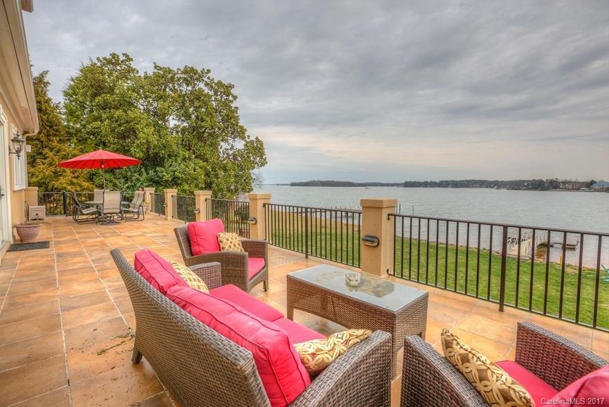 WF home enjoys level lot & expansive waterviews inside & out! Masters each level. Open flrplan w/spacious rooms. Formal DR, Butler pantry & Office w/french doors/FP. Main kitch Lake-view windows reflect light across granite tops & SS appls. GR w/FP  & Master w/views & terrace access. Jetted tub, 2 vanities, WI shower & WIC. 2 BRs up (1 En-suite w/WIC) + Loft & Bonus. Lower 2nd liv qtrs w/2 BR, Bath & Fitness + Kit, Rec & Media spaces opening to Cov Patio w/fans. Firepit & Lake Dock w/slip.