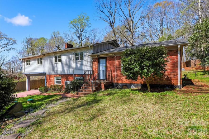 Nearly 0.5 acre with no HOA, a flexible layout, and income-producing opportunity. This tri-level property offers multiple living areas with separate exterior entrances, ideal for house hacking, multi-generational living, or continued investor use.

Fully fenced with gorgeous sunsets and lake views nearby, in a private wooded setting minutes from CLT Airport, Belmont, the Whitewater Center, and the future River District.

Several key updates include: roof (2022), water heater (2023), mini-split heating and cooling systems (2023), & permitted well system (2023).

Listed as 3BR/1BA per tax records. Sold AS-IS. Unpermitted 2 additional kitchens & 2 additional bathrooms are currently present. 
Buyer to verify layout, permits, square footage, and intended use.