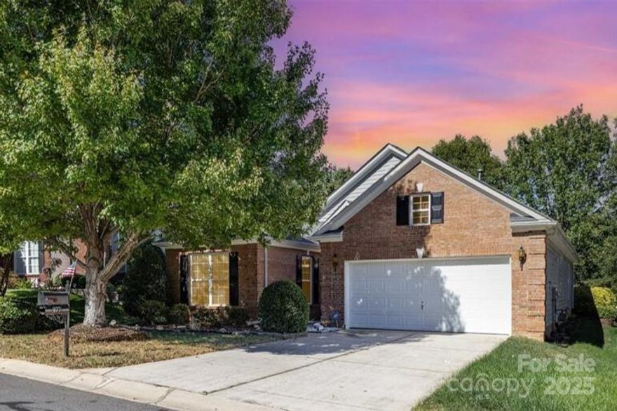 Welcome home to this beautifully maintained ranch offering thoughtful design and inviting spaces throughout. The open floor plan features a spacious living area centered around a cozy gas fireplace, creating the perfect spot to relax or entertain. The bright kitchen features white cabinetry and ample counter space, flowing easily into the dining area and sunroom—ideal for morning coffee or reading with a view. Step outside to a stunning hardscaped backyard with a paver patio and mature privacy trees, offering a peaceful outdoor retreat. The split-bedroom layout provides a comfortable primary suite separate from the secondary bedrooms for added privacy. Upstairs, you’ll find an unfinished space above the garage with permanent stairs, ready to be transformed into a bonus room, workshop, or additional storage. Enjoy a home that combines warmth, functionality, and room to grow—all in a welcoming community setting!