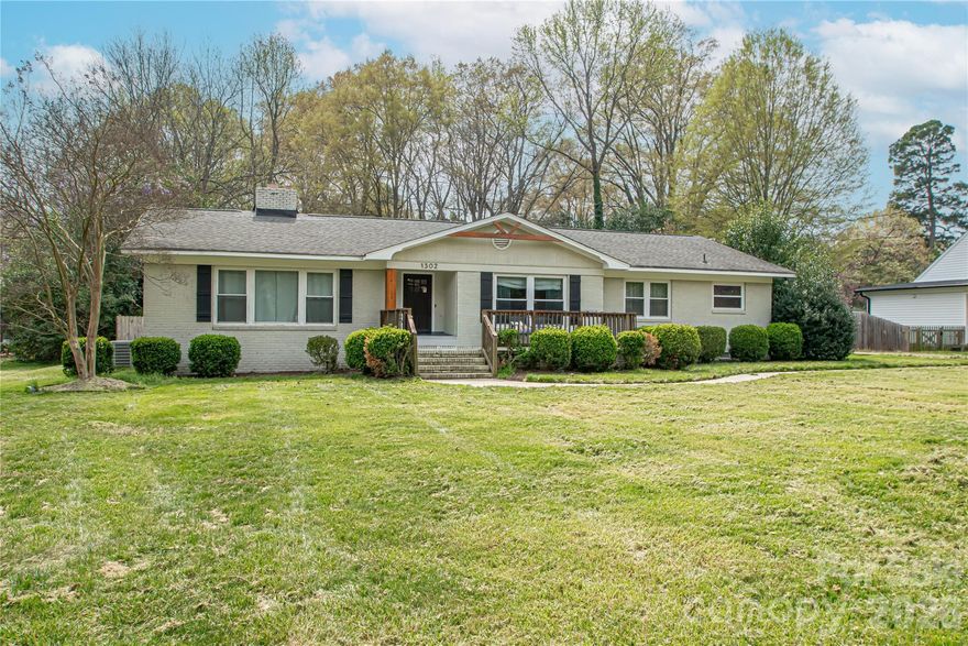 Welcome home to this beautifully updated brick ranch, perfectly situated on a level, fully fenced 0.51-acre lot. Offering 2,119 square feet of thoughtfully designed living space, this 3-bedroom, 2-bath home blends timeless character with modern updates. Renovated in 2020, the home features stylish upgrades throughout, including updated bathrooms, contemporary light fixtures, and inviting living spaces. The spacious layout includes a warm and welcoming family room, a separate living room, and a versatile dining room that can easily function as a sunroom—complete with charming barn doors for added character and flexibility. The kitchen is both functional and inviting, featuring an island that conveys with the home, perfect for entertaining or everyday living. Step outside to enjoy the covered front porch or relax on the expansive backyard patio overlooking the large, private yard—ideal for gatherings, gardening, or simply unwinding. Additional highlights include a 2-car carport, as well as extra storage or workshop space to suit your needs. Conveniently located near the hospital, schools and downtown Monroe, this home offers both comfort and accessibility.With its blend of charm, updates, and outdoor space, this property truly has it all—don’t miss your opportunity to make it yours!