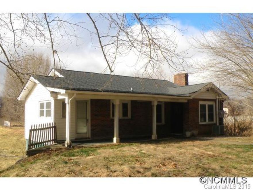 Cute 2 BR, 2 bath home near Warren Wilson college, level 6.47 acres of land, mostly pasture, tons of frontage on Swannanoa River, large sheds, greenhouse, sold as is.