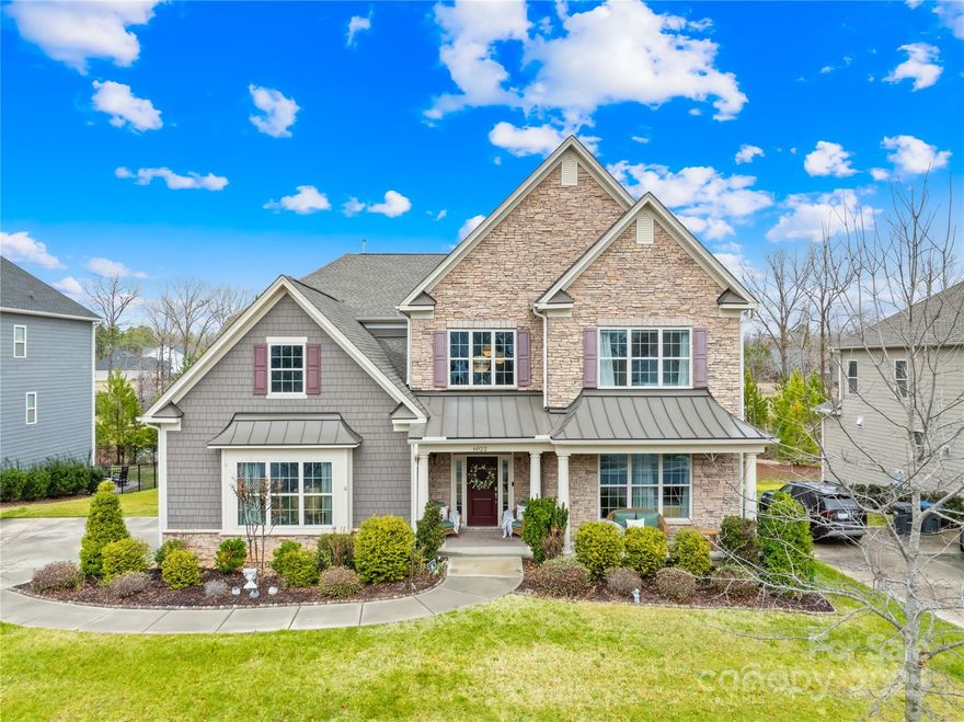 NEW PRICE! MULTI-GENERATIONAL LIVING!  Nestled in the exclusive Bent Creek Development, this stunning 6 bed 5 full & 2 half bath, Burlington Farmhouse-style home offers 5,000+ sq ft of finished space on just over a quarter acre. Built in 2019, it features an open floor plan, 10’ ceilings, LVP flooring, and a gourmet kitchen with an oversized quartz island, Carrera marble backsplash, and KitchenAid appliances. The main-floor owner's suite showcases a spa-like bath with dual vanities, a Roman tub, and a walk-in closet. Upstairs offers 3 bedrooms with en suite baths and a bonus room. The basement  features an in-law suite with a full kitchen, bath, and private entry. Outdoor living shines with a screened porch, gas fireplace, Trex decking, and a private backyard. Additional features include custom lighting, in-ground sprinklers, epoxy garage floors, and New Age cabinetry. This home blends luxury, comfort, and functionality in an unbeatable location! Ask for the features & upgrades sheet!