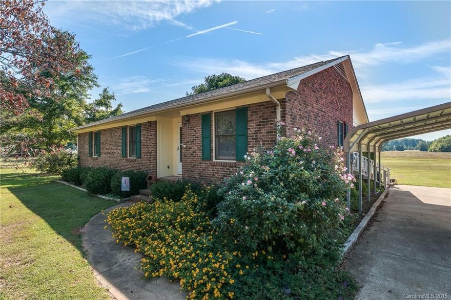 USDA Eligible!...You will love this charming all brick ranch in a serene country setting on 1 acre! This lovely 3BR/2BA home features a lg. master suite & open kit/din area. Relax in front of the LR FP or enjoy your evenings on the screen-in porch. This home has a 2-c carport in addition to a 1-c det gar; which is equipped w/220 electric hookup making it a great workshop. This home has been meticulously maintained & includes fresh paint, carpet recently replaced. Don't Miss out on this one!