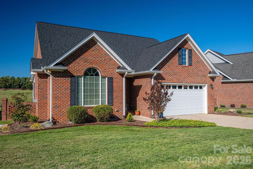 Welcome to this beautifully maintained 3BR all brick patio home in desirable Spring Forest. Designed with both comfort and style, this home features custom details throughout including soaring volume ceilings, elegant architectural columns and heavy moldings, a bright and open floor plan perfect for everyday living and entertaining.  Spacious primary suite with trey ceilings and serene backyard views.  A dedicated office space provides flexibility for remote work or hobbies, large pantry and laundry all with easy access. Step outside to enjoy the newly landscaped yard, complete with irrigation for easy upkeep. Relax year round on the screened porch and open brick patio overlooking peaceful pastures. This home has been meticulously cared for, with extensive maintenance already completed, including a new roof and gutters. The HOA covers lawn and garden maintenance, allowing truly low-maintenance living. A perfect blend of quality, convenience and  thoughtful design, this home is move-in ready and waiting for its next owner. Located just minutes from from exit 193 on the new Hwy 74 Bypass.