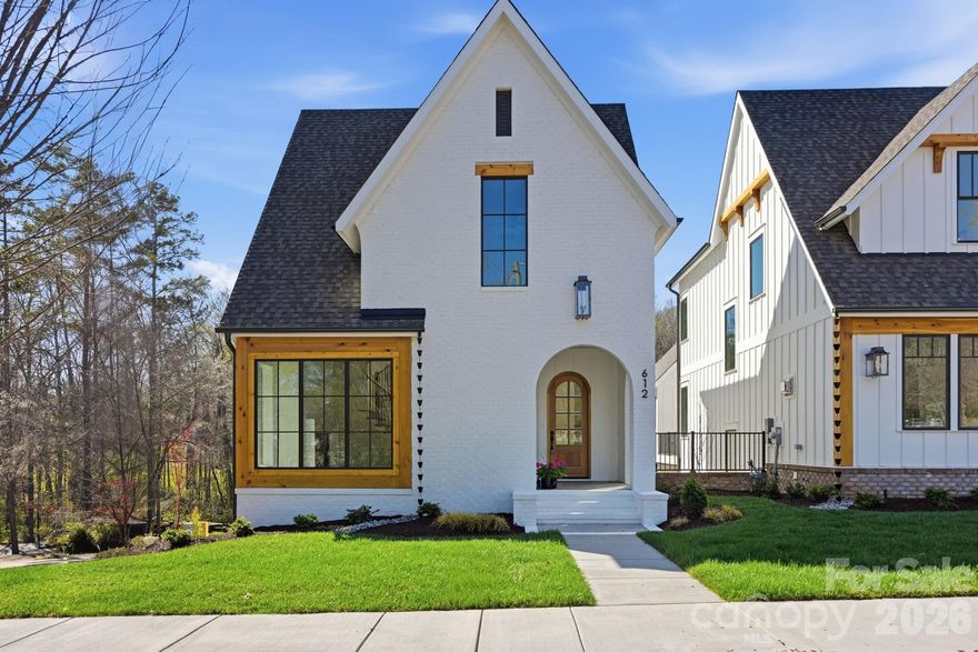 Walk to Davidson's acclaimed Main Street from your front door — morning coffee, farmers market Saturdays, and evening dinners, all without a car. This 5-bedroom new construction home sits on a premier end lot in Davidson Springs, a boutique community where the HOA handles every inch of landscaping so your weekends stay yours. Inside, the floor plan delivers a main-level primary suite, chef's kitchen, and curated designer finishes chosen by an award-winning Davidson-based builder. The bonus room, private office, and spacious secondary suites make this suited for buyers who refuse to compromise.