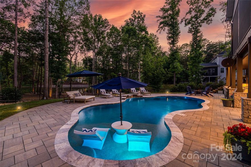 Gorgeous Lake Norman Waterfront Oasis!! Situated on an over 1 acre cul-de-sac lot this ranch w/ basement caters to an open floorplan with stunning features.   As you enter, the dining area with stained wood ceilings sets the stage for this tranquil home. Chefs' kitchen boasts high end cabs, gas range, pot filler, & an amazing island.  The picturesque waterfront views are the heart of this home. Expansive bi fold doors open up from the great room to the screened in porch overlooking the sparkling salt water pool & lake--The perfect spot to enjoy your morning coffee with nature. The owner's suite welcomes you to a spa like bath retreat, huge walk-in closet, & a porch facing the water. As you head down to the full walk out basement, you will not want to miss the killer entertainment area, home gym, & guest suite.  The outdoor space is fully equipped with a bar area/grill, pool/patio & deeded boat slip. Take a walk down to see the peaceful shore area. Don't miss this opportunity!