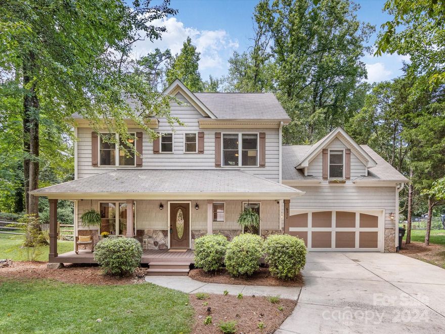 Nestled on almost a half acre wooded lot with a fenced backyard, this one-of-a-kind, custom home features many special architectural details! Gorgeous arches, beautiful ceilings & high quality moldings make this home stand out. The open floorplan features a family room w/ a gas log fireplace & a kitchen w/ glazed cream furniture-style cabinetry, a breakfast bar, solid surface counters, & stainless steel appliances, incl. a gas range. Hidden stairs just off the kitchen lead to a fantastic bonus room w/ built-ins over the 2 car garage while the 2nd staircase leads to a primary suite w/ a tray ceiling, a walk-in closet w/ built-ins & a bath w/ custom cabinetry, linen & water closets, a garden tub & a separate shower. Two additional bedrooms upstairs are gracious in size & feature built-ins w/ desks, ceiling fans & custom closets. A covered front porch, a screened back porch & a patio all overlook the lovely lot! Not to be missed: the encapsulated crawl space, 2 car garage, & new HVACs!