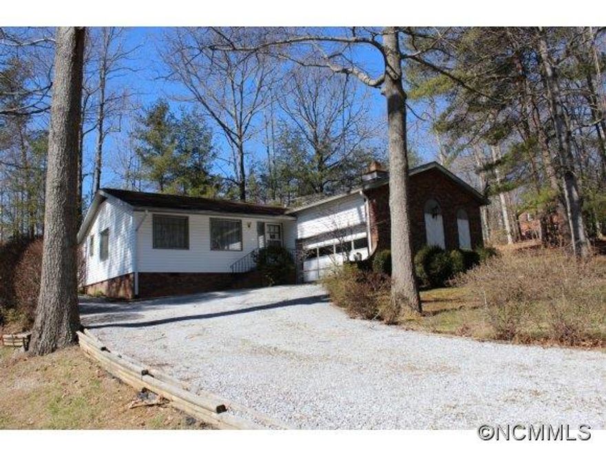Cute house with Beechwood Lake privileges included--perfect for entertaining visitors on a hot summer day.  This lovely home has a formal living plus den with a fireplace, good sized kitchen, 2 BR's plus an extra room for sewing / hobby/or a study.  Screened porch, Hardwood floors in den and dining room. New roof. Also included is extra parcel Pin#DB 1267/542. Lg lot w Room for garden, storage building.