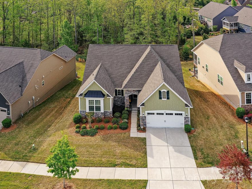 You will LOVE this WELL-KEPT Sun-Lit home w/ Treed Private Lot! Ranch Home w/Finished Basement! Need more Space? Need Storage? Need Visitor Quarters? Wow! This home has it all! Gated 55+ Community w/Full Time Security Guards! Lovely Landscaped Yard, Large Scrned Porch Overlooks Common area w/Trees! Paver Patio Full Length of Home! Gourmet Kitchen w/White Cabinets & Upgraded Hardware! Subway Tiled Backsplash, Double Wall Convection Ovens. Gas Range! Roll-out Shelving! TWO Pantries w/Solid Shelving! Upgraded Light Fixtures & Fans! Additional Moldings! Granite in Kitchen, all Full Baths, & Laundry! Wide Plank Hardwd Floors! Wonderful Primary Bdrm w/Moldings, Plantation Shutters & Newer Carpet! Framed Mirrors in 2 Baths! 3 Bdrms on Main Level. Lower Level w/Large Guest Bdrm & Full Bath Plus Card Room & Wet Bar. Plus Den w/Built-ins & Gathering Room ideal for Pool Table location! AND TONS of STORAGE! Finished & Painted Garage w/Tankless Water Heater & Epoxy Flooring! VERY Desirable Street!