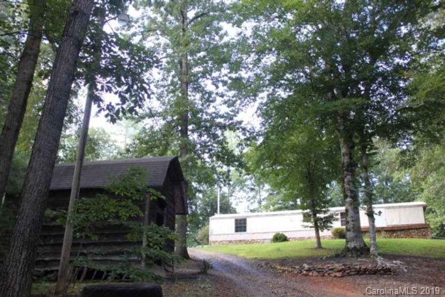 This 1986 Mobile/Manufactured Home 14 x 70 has one bedroom and one bath. The rest of this home has been remodeled and opened up for more spacious living. It is possible to have another bedroom in the home. if desired. Also, two outbuildings are on the property near the home. Plenty of room for travel trailers to park at the home too. The property is situated in the western part of Burke County in a secluded location surrounded by large tracts of land and the Pisgah National Forest. This property is located only minutes from the Brown Mountain OHV (Off-Highway-Vehicles) Trail System. This Trail system has 34 miles of fun and entertainment for the off road enthusiast.