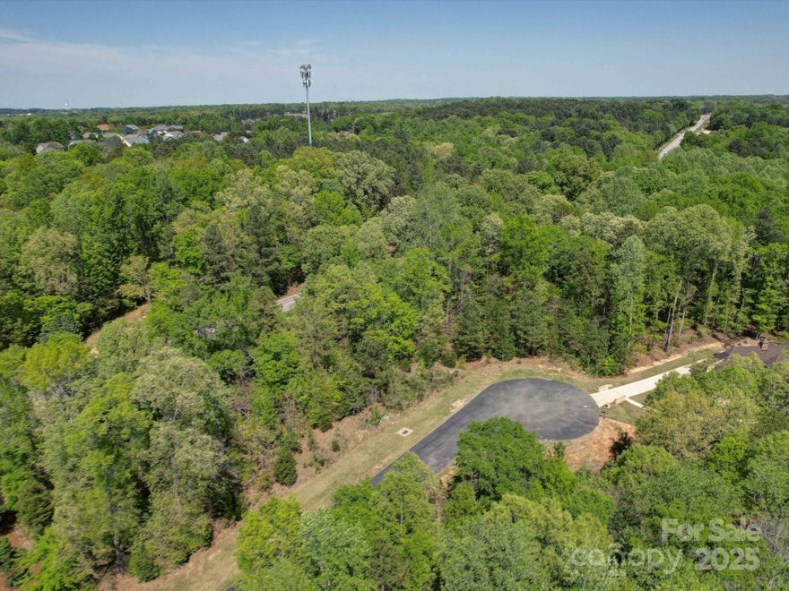 Seize the opportunity to build your dream home on this stunning nearly half-acre lot in one of Indian Land’s most sought-after luxury gated community Longbrooke. Enjoy the perfect blend of privacy and convenience, with a serene wooded setting and proximity to top-tier amenities. 
Just minutes from Ballantyne, this prime location offers the benefits of low South Carolina taxes while keeping you close to shopping, dining, grocery stores, and a medical center. Don’t miss the chance to create a custom home in this prestigious neighborhood!