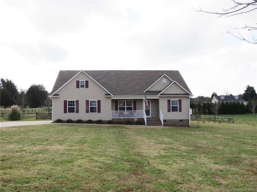 This beautiful split-BR home w/a covered front porch & retractable awning covered back deck sits at the center of a 1.04 ac corner lot. The family room features a fireplace, hardwood flrs & vaulted ceiling. Eat-in kitchen w/stainless steel appl, granite counters, breakfast bar & patio doors leading to the deck & fenced backyard w/shed. The master bedroom has a tray ceiling & master bath featuring separate sink area & walk-in closet. A guestroom/office w/separate entrance is located above garage.