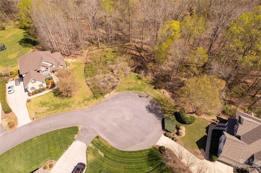 Cul de sac lot. 2200 min sqft building restriction. Self governed HOA. 100 year flood plain at back of property. Neighborhood plat and Fema firmette attached in docs. Utilities providers: York Electric, York County Natural Gas, City of Rock Hill Sewer, well needed. Nothing is tapped.