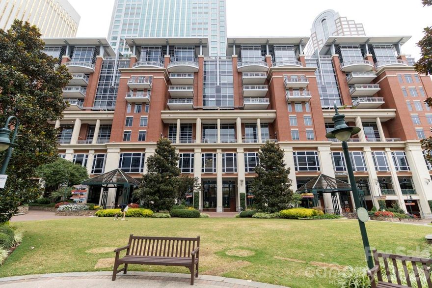 Welcome to an extraordinary Penthouse residence in The Ratcliffe, one of Uptown Charlotte’s most distinguished addresses. This two-level, loft-style home is a masterclass in refined urban living, where every surface, view, and architectural element contributes to a narrative of elegance, sophistication, and character.
From the moment you enter, you’ll appreciate the seamless flow of the open-concept main level. Floor-to-ceiling glass walls bathe the living, dining, and kitchen spaces in natural light, framing stunning South Tryon and skyline views. A dramatic floating glass-and-metal staircase becomes a sculptural centerpiece.The chef’s kitchen is a masterpiece—custom-designed by Poliform, Italy’s premier luxury cabinetry brand—featuring sleek, handle-free surfaces, integrated  appliances, a built-in coffee station, and minimalist finishes that define modern elegance.  Culinary enthusiasts will appreciate the Gaggenau appliance suite, celebrated for its precision engineering and sleek aesthetic, seamlessly integrated into Poliform custom cabinetry. Rich stone surfaces set against crisp lines and muted tones. Upstairs, the private quarters unfold with equal luxury and flexibility. A refined kitchenette or bar area supports the vision of a second living suite, guest retreat, or intimate lounge. This level flows seamlessly to a spectacular rooftop terrace, one of the home’s most captivating features. With multiple seating areas, space for grilling, and panoramic city views, this expansive outdoor haven offers an unmatched backdrop for morning coffee, sunset cocktails, or evening gatherings under the city lights. It’s the perfect blend of privacy and vibrancy, high above the heart of Uptown.
The primary suite is its own sanctuary: a spa-like bath with dual-sink floating vanity, freestanding soaking tub, frameless glass shower, and precise architectural lighting. A custom walk-in wardrobe of dark wood cabinetry offers an abundance of tailored storage.
Built with intention, this home is punctuated by premium finishes—wide-plank wood floors and concealed accent lighting; and discreet climate and sound-zoning systems ensuring comfort at every level. Every finish was selected to support a feeling of quiet luxury, balance, and visual calm. Crestron smart-home integration—often regarded as the Rolls-Royce of home automation—manages audio, video, and lighting systems for an elevated living experience. Yet this home is also steeped in Charlotte lore. The Ratcliffe condominium tower was sensitively built around the restored Ratcliffe Florist Shop, originally constructed in 1929 in Mediterranean Revival style and designed by local luminary architect William H. Peeps. The neon “Ratcliffe’s Flowers” sign remains an iconic piece of Uptown visual history.

Residents here enjoy direct access to the Overstreet Mall — connecting retail, services, and links to major office towers — without stepping foot outside on inclement days. 

 The Ratcliffe also fronts “The Green”, an interactive pocket park with sculptural elements, water features, quiet garden paths, and vibrant public activation, creating a rare balance of urban energy and tranquil respite.
Project for Public Spaces

From this vantage point, you are within walking distance to the Bechtler Museum of Modern Art, the Knight Theater, BB&T Ballpark, fine dining, cultural venues, and the pulse of Charlotte’s financial district.

If you’re seeking a home that is as functional as it is beautiful—a space with strong architectural presence, refined materials, and unique historical soul—this penthouse at The Ratcliffe delivers in every category.