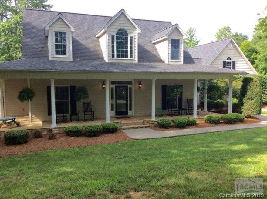 REMARKABLE CUSTOM-BUILT home with exceptional privacy on almost 5 acres, and minutes to Lake James.  Soaring vaulted ceiling, beautiful custom cabinetry and hardwood floors.  Main level features beautiful kitchen with granite countertops, and breakfast nook; formal dining room; living room with gas fireplace and French doors leading out to deck which overlooks the professionally landscaped yard; Master suite with tray ceiling, walk-in closet, soaking tub/separate tiled shower, double sink vanity and make-up bar; laundry completes this level. Finished walk-out lower level includes family room, second kitchen, hobby room, and full bath; office with custom built cabinetry including file drawer finishes this level.  Don't miss the expansive porch and the large 2 car garage with 1/2 bath plus over 650 square feet of bonus space to be used for storage or could be finished into a guest suite.  Truly a must see and priced to sell!