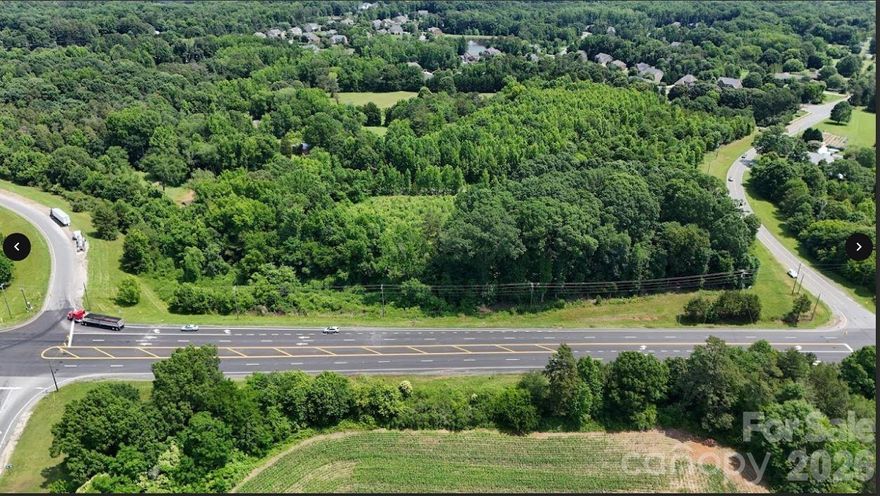 4.41 ac available at Hwy 218 ( Mint Hill Exit) just off I-485 at Brief Rd/Hy 218 traffic light. See Mint Hill Town Plan for future zoning options. This parcel will not be approved for convenience store/gas station. Also across Hwy 218 is 3.14 ac available. Call broker for options. City water available to tap on. Sewer needed.