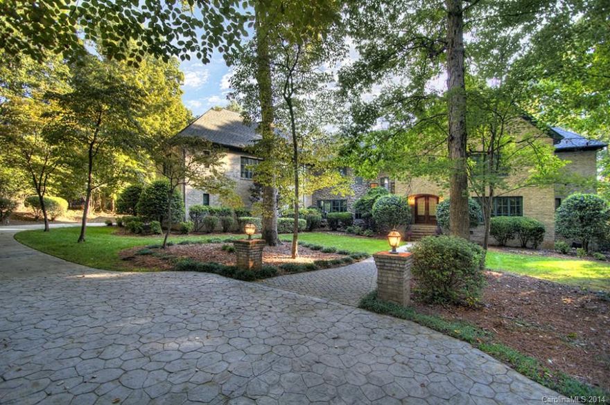 Gorgeous custom on private drive with spectacular lake setting, wooded 3.78 acres. Enjoy nature, tranquility & quiet w/ in-ground PebbleTech saltwater pool, screened outdoor room w/ stone FP, terraces, landscaped grounds. Master bed & library on main, full formals. Media room cabinetry c/be converted to closet for BEDROOM 5. Huge granite kitchen open to GR. 4 interior FP's. Encapsulated crawl, 2012 Owens Corning Lifetime Roof, JELD-WEN windows. 3-car gar, w/in attic, massive rec rm, wine cellar.